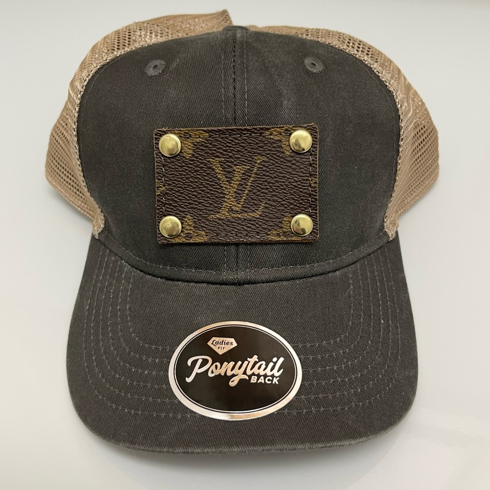 Repurposed canvas for logo. Louis Vuitton Black and Tan Trucker Cap. Ponytail